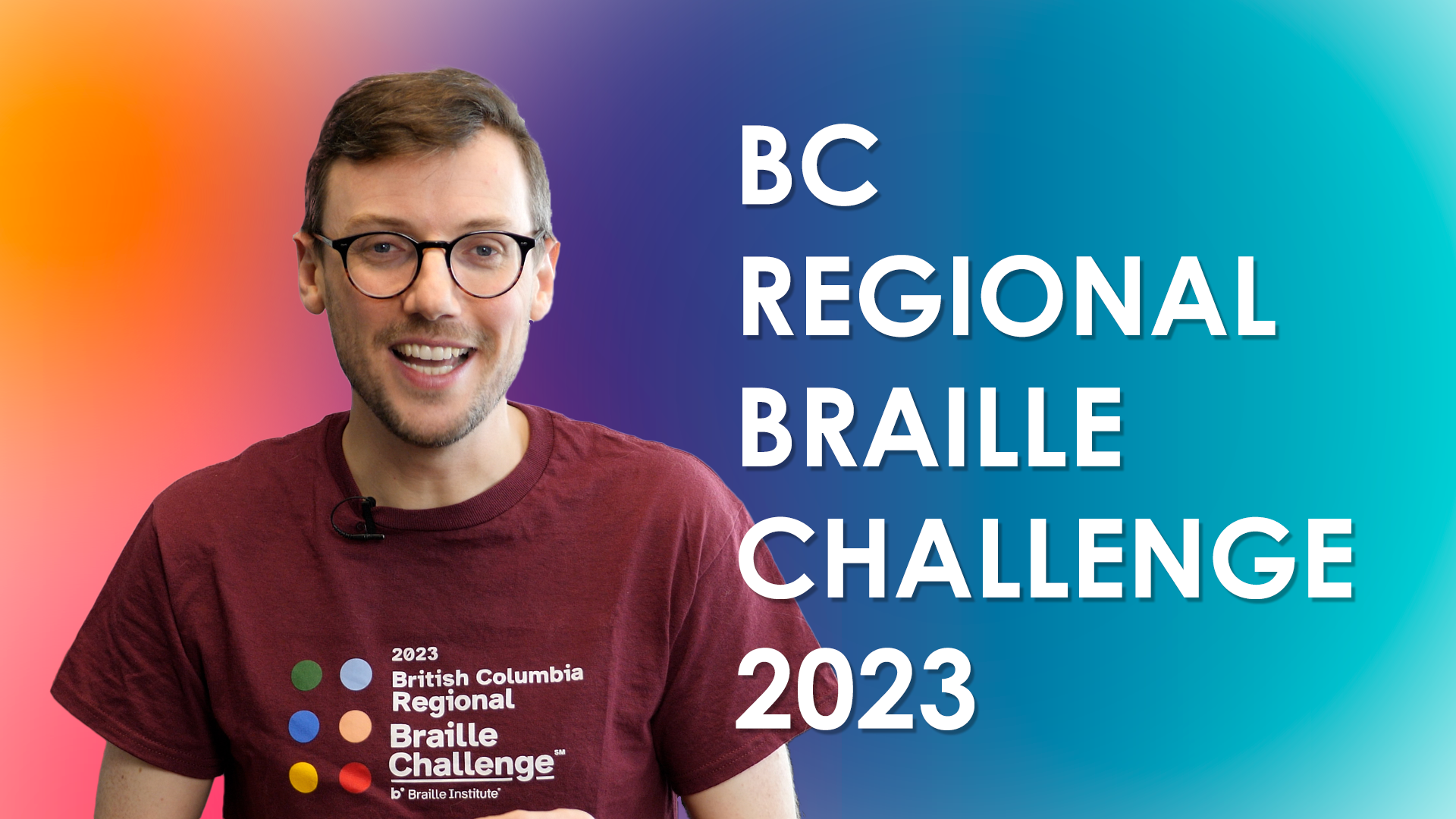 Adam smiles while wearing a burgundy Braille Challenge t-shirt. Caption reads: BC Regional Braille Challenge 2023